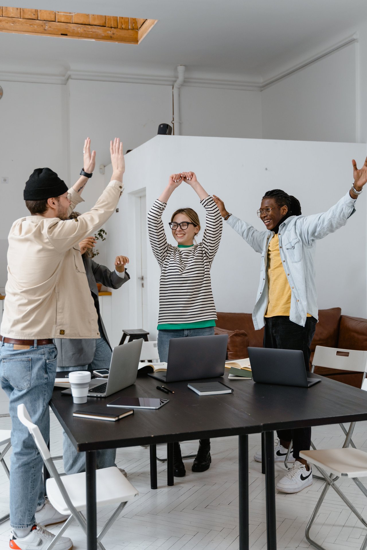 Image of people doing high-fives